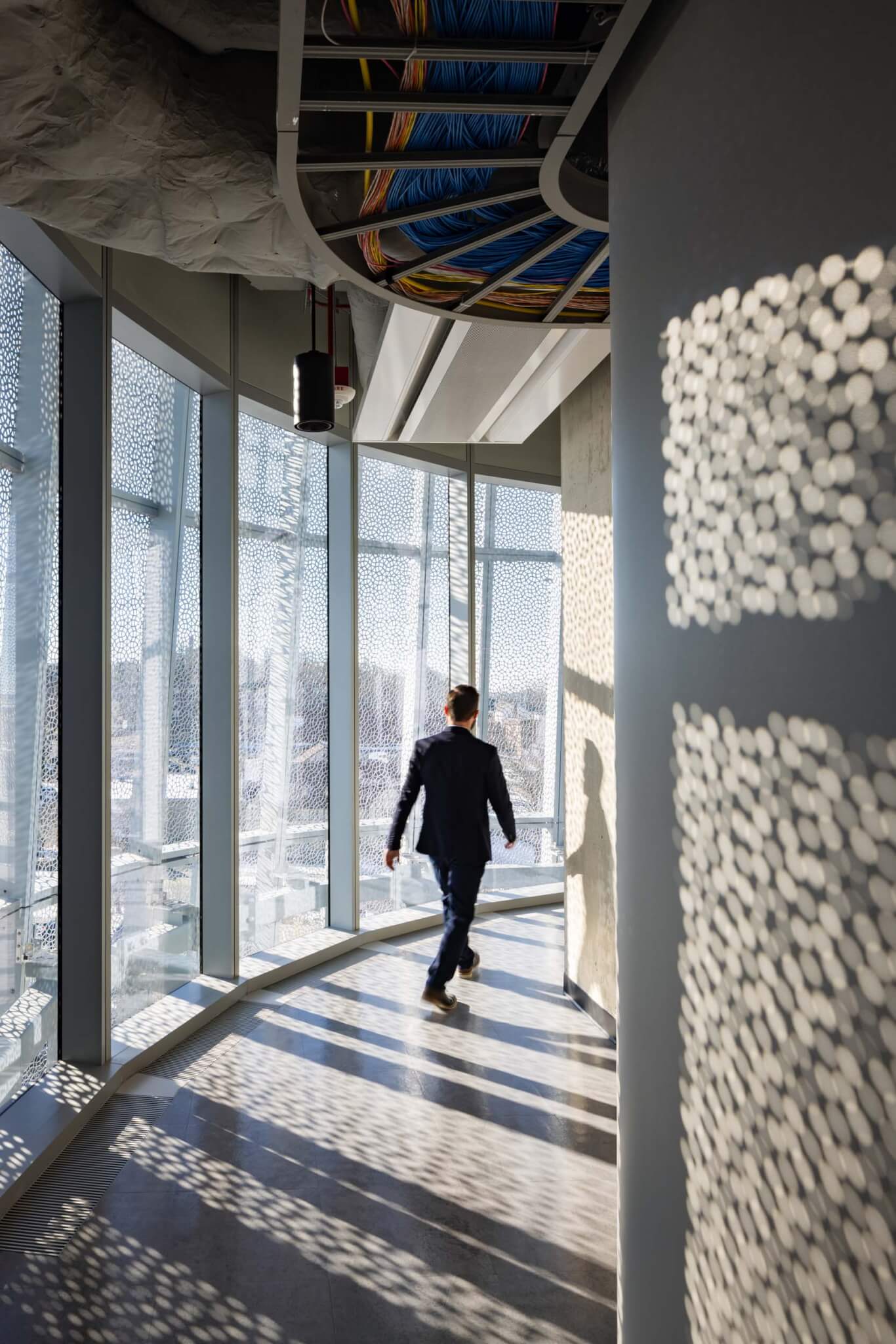 person walking in curved hallway