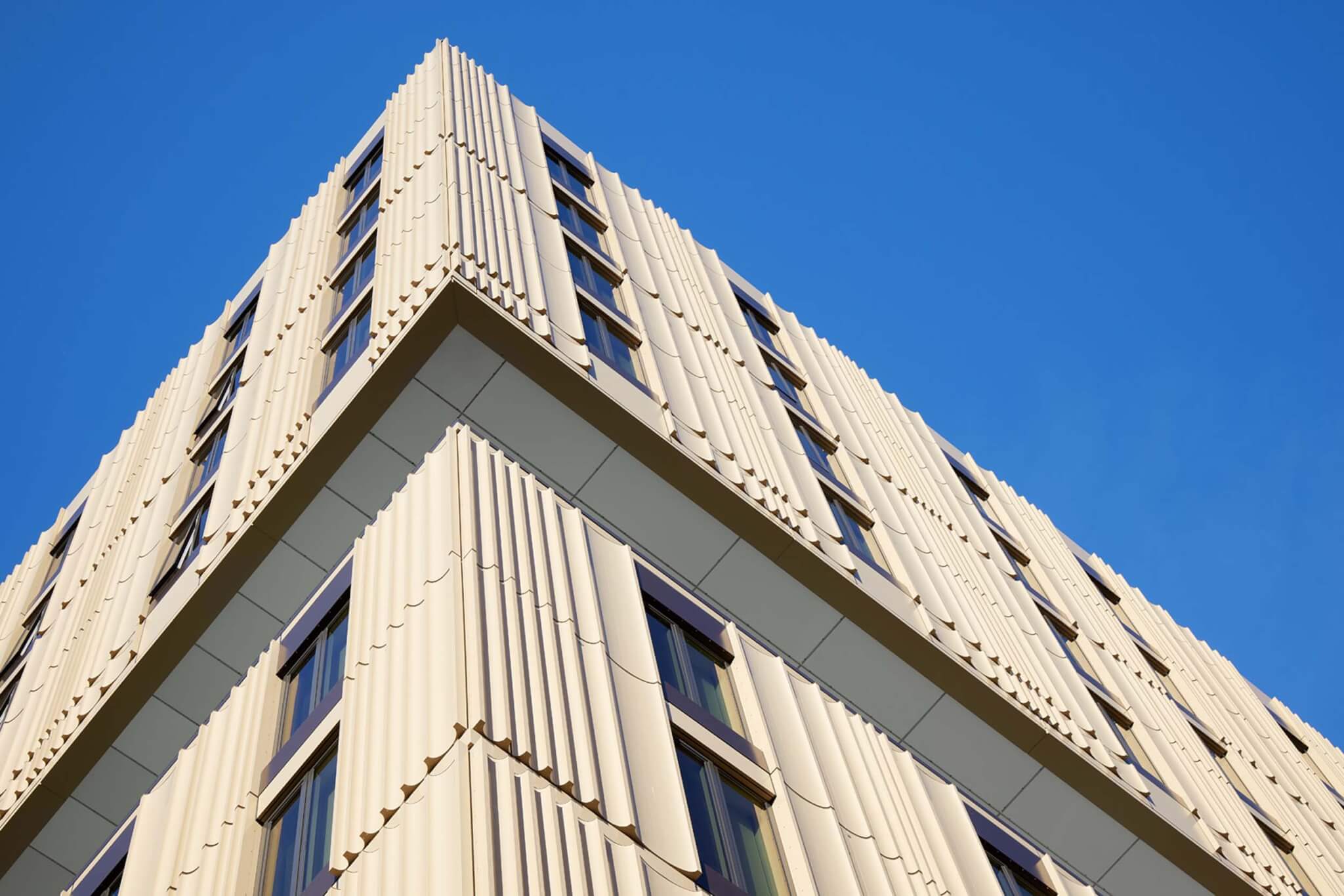 close-up view of facade featuring fluted aluminum cladding