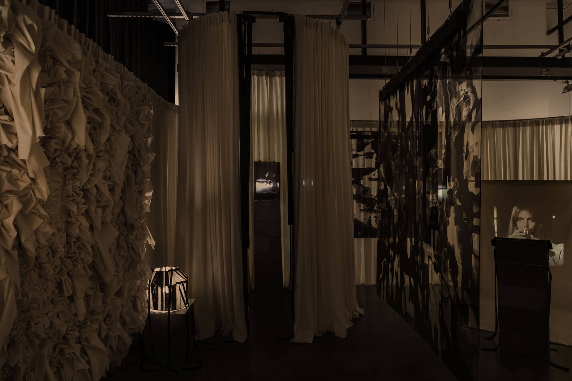 Interior view of Girlroom exhibition with curtains 