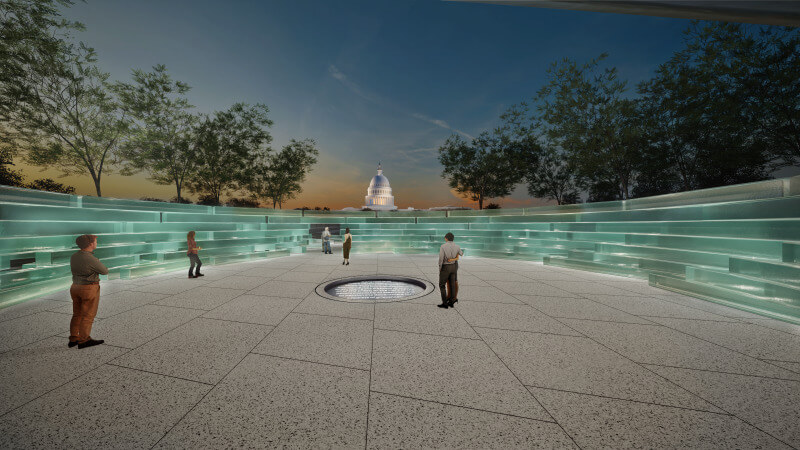 a view of the memorial at night with the glass bricks that form it lit up