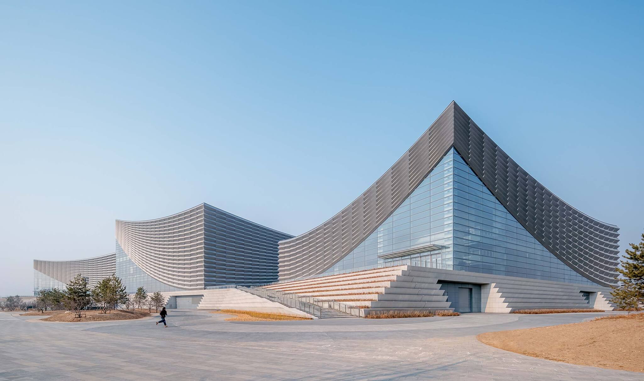 Beijing Performing Arts Centre is surrounding by paved landscape and plinth