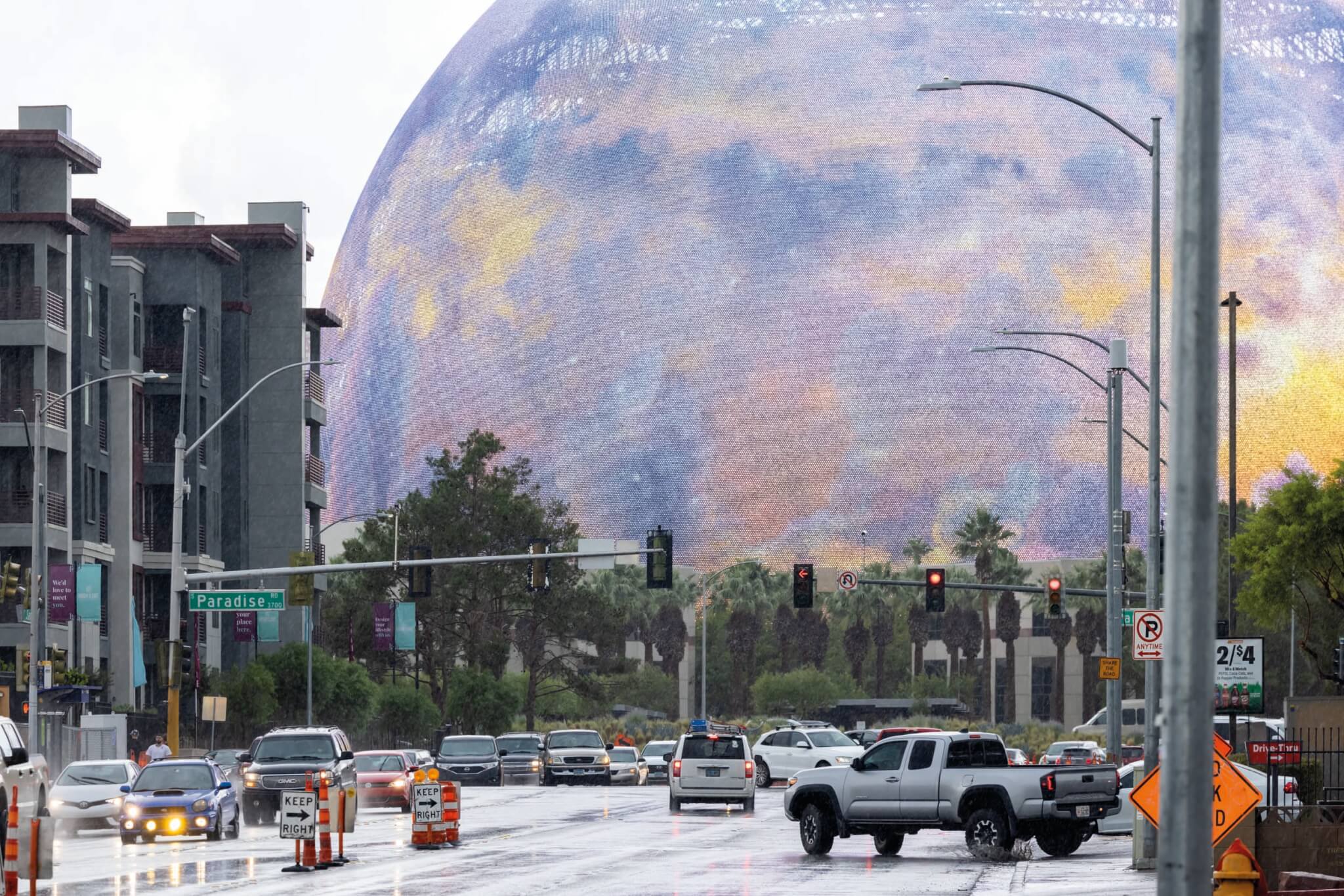 a street in las vegas showing the sphere