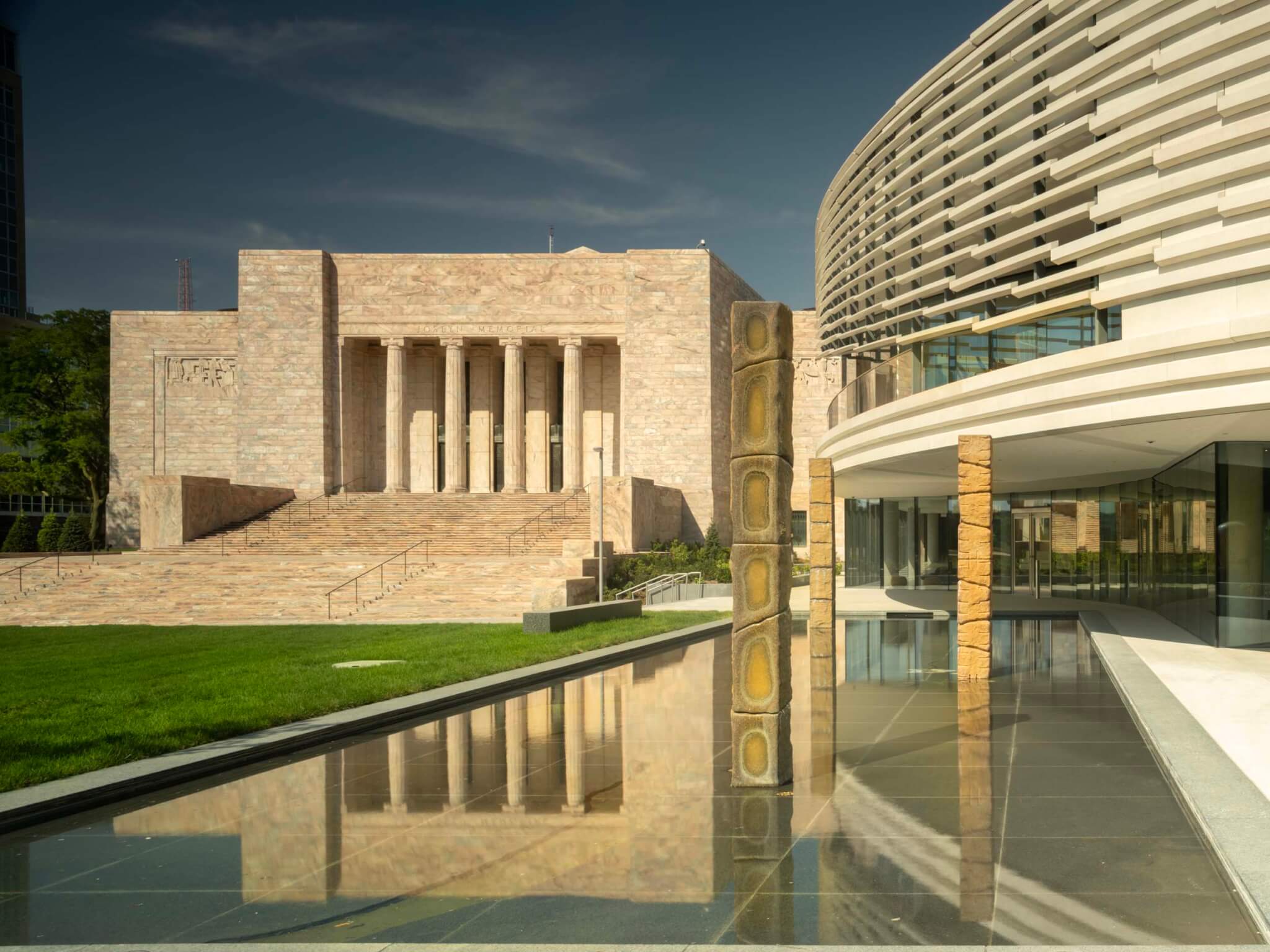 original joslyn art museum building facing a reflecting pool