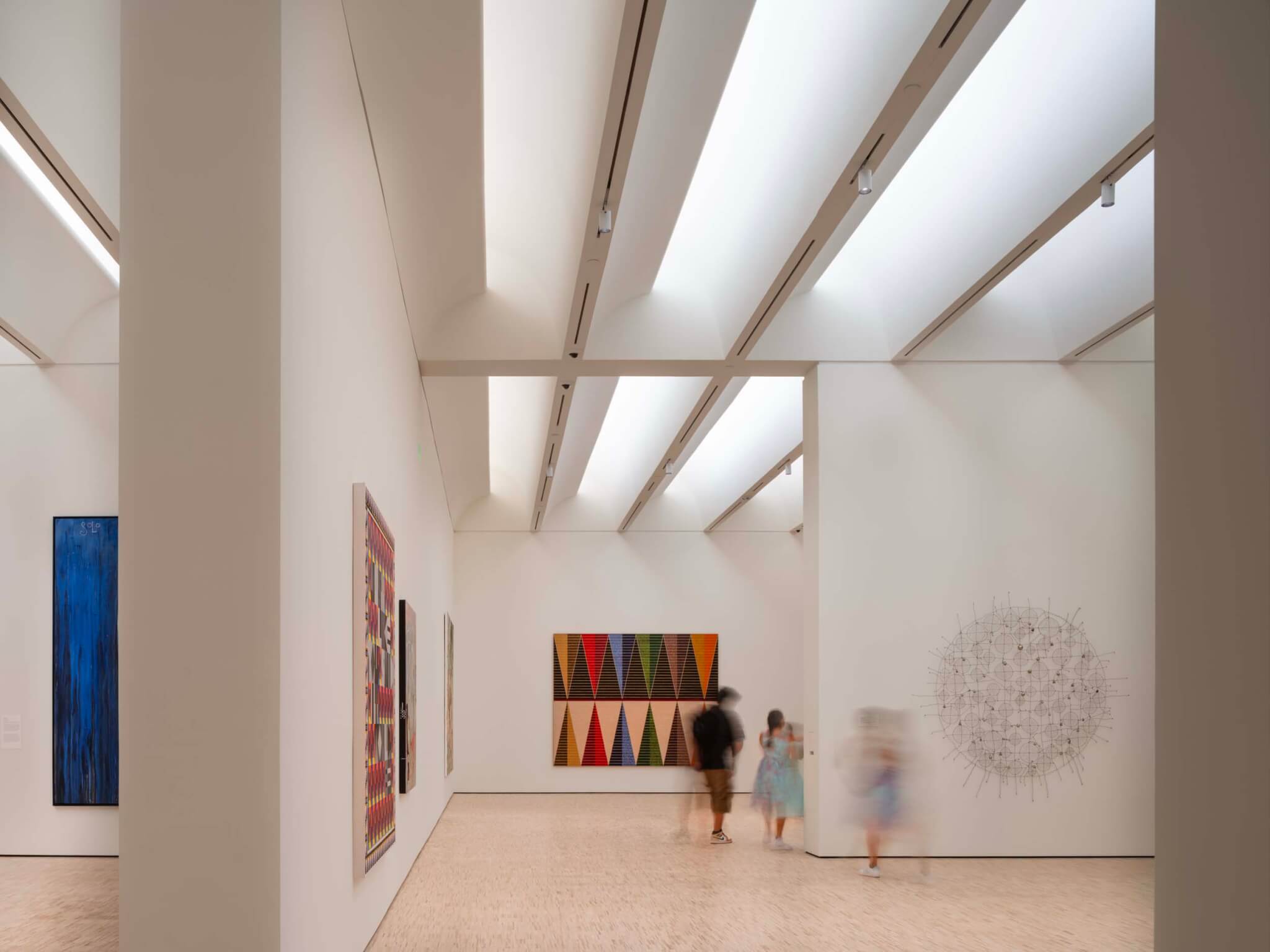 gallery spaces are white and have translucent skylights