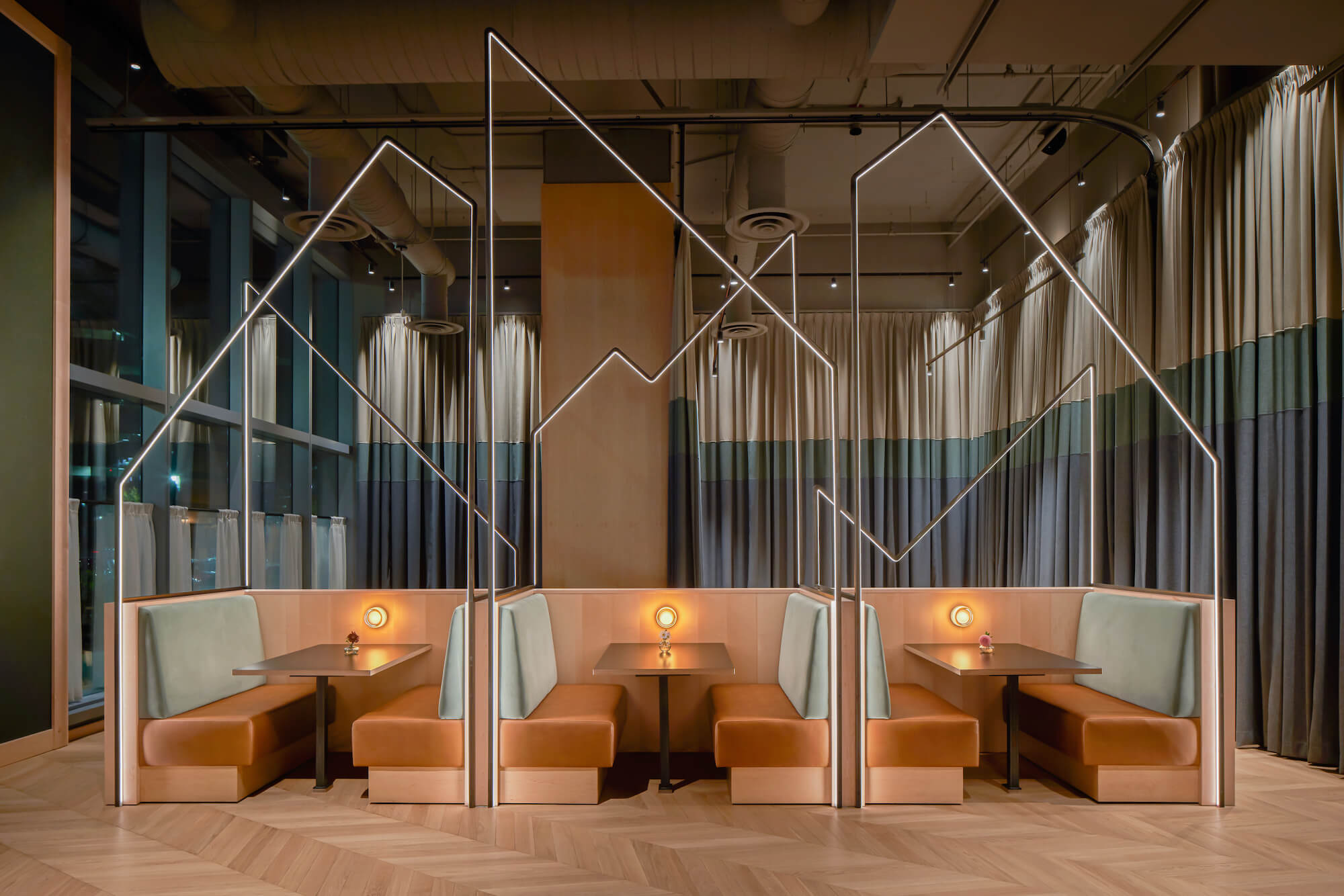 A bar in DC with mountain ranges made out of LED over booths