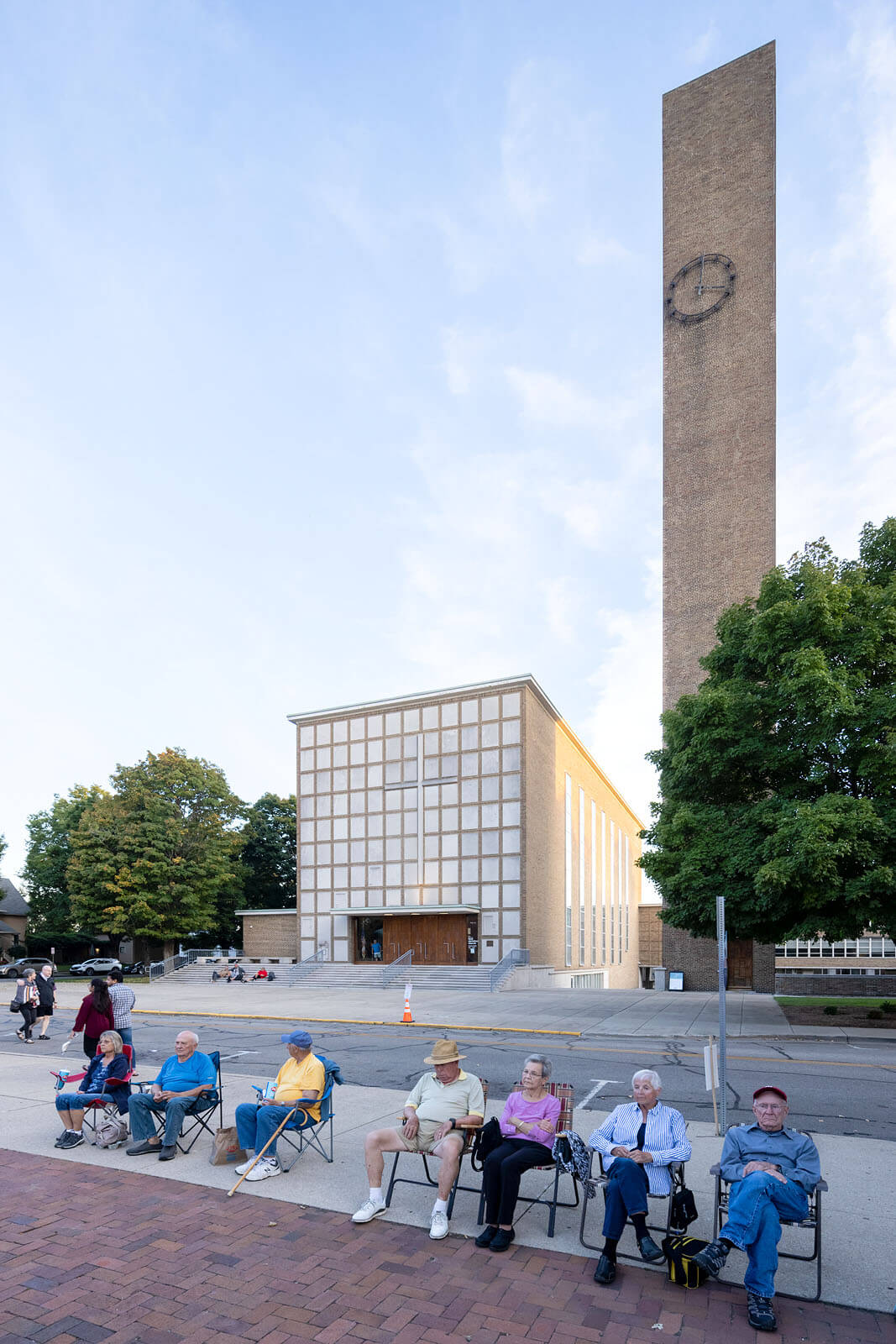 Residents relax in front of a Columbus, Indiana, landmark