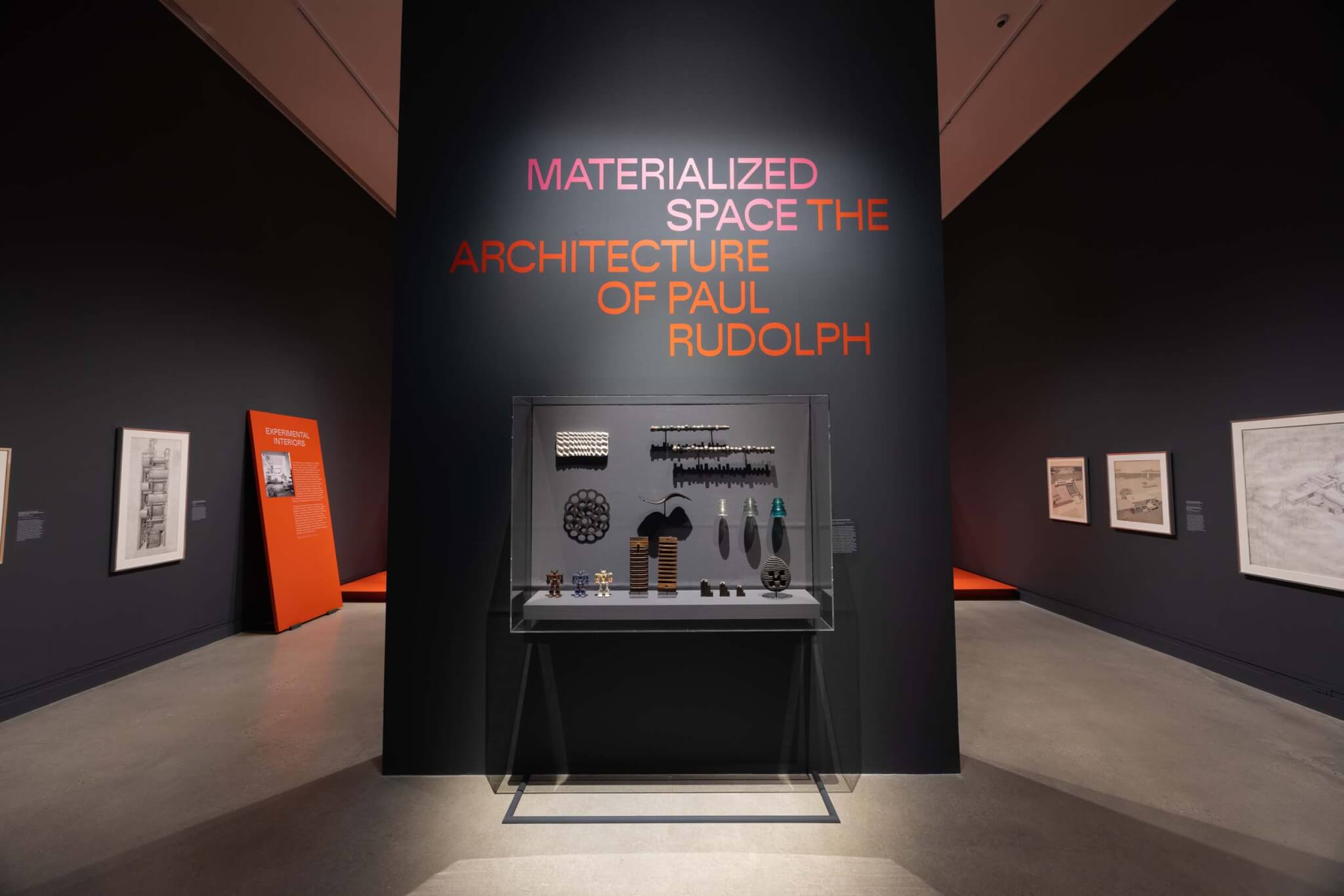 artifacts in display case and drawings hung on wall for Paul Rudolph exhibition at The Met