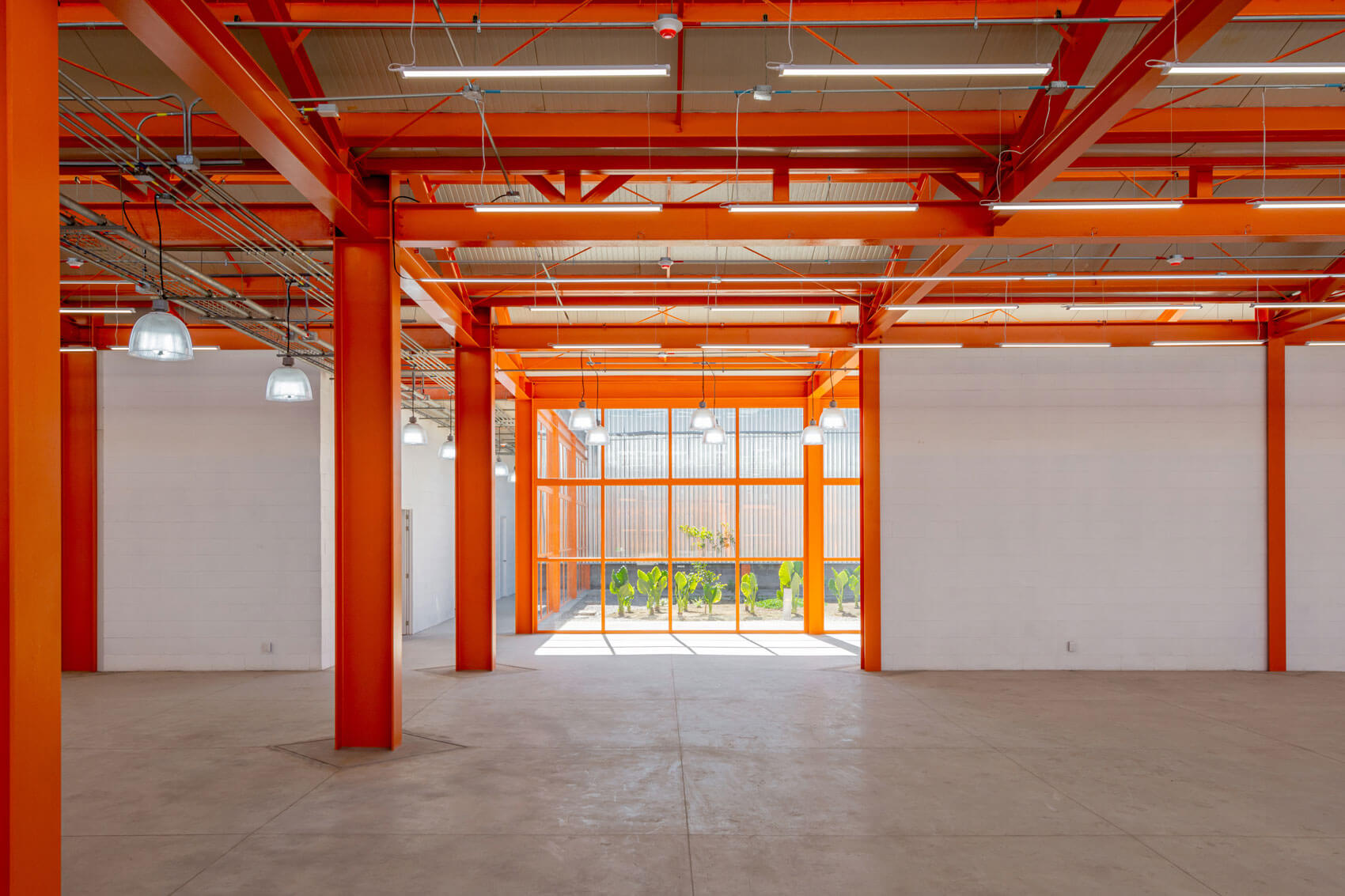 red columns and ceiling beams inside the complex