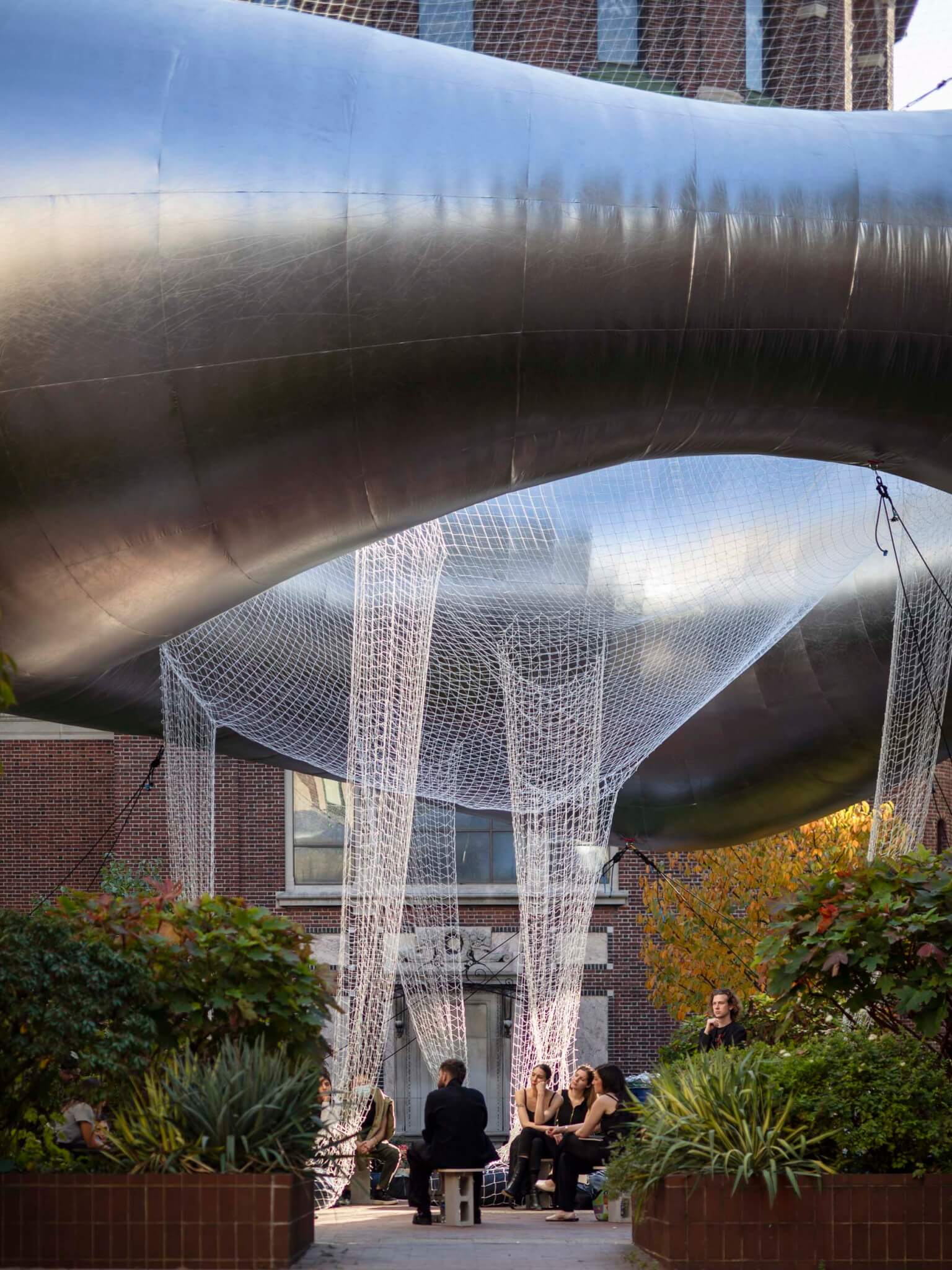 People gathering at Columbia GSAPP courtyard installation