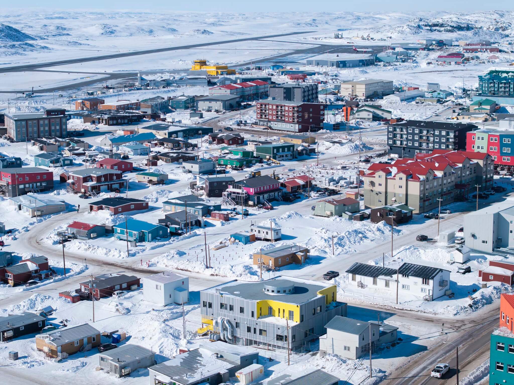 aerial view of downtown Iqaluit showing bright colors of buildings