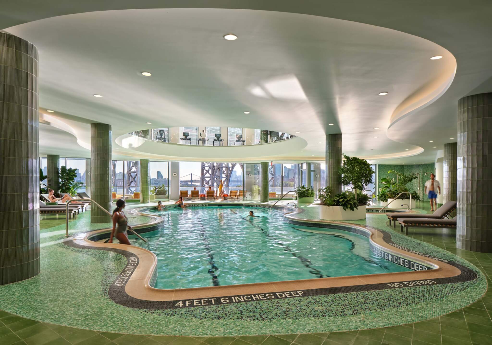 the indoor pool features playful shades of green and blue