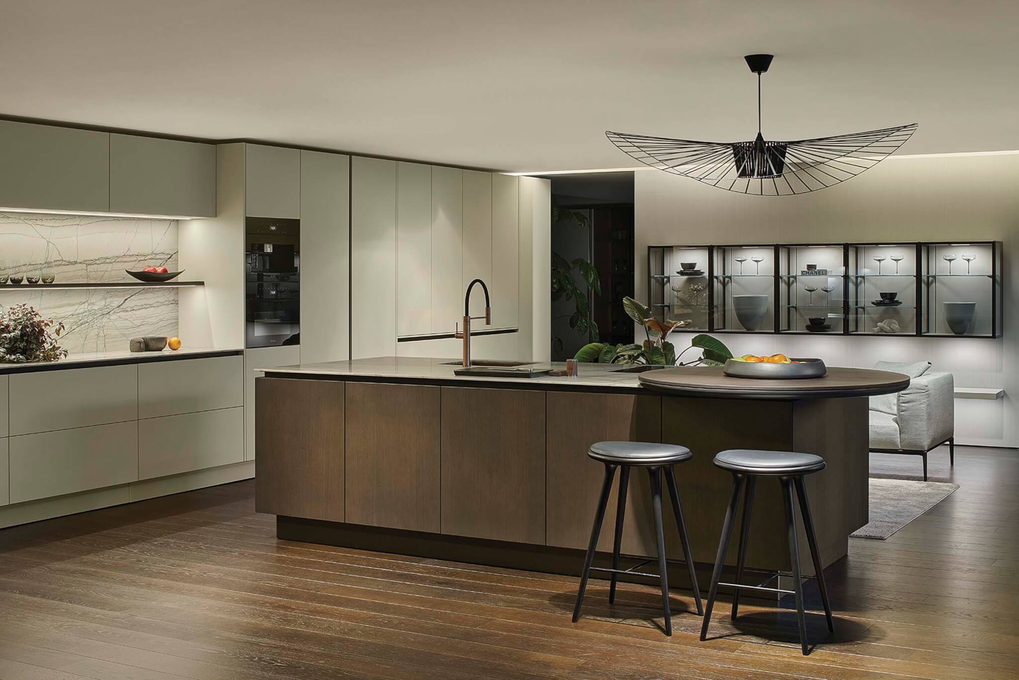 counter with two black bar stools