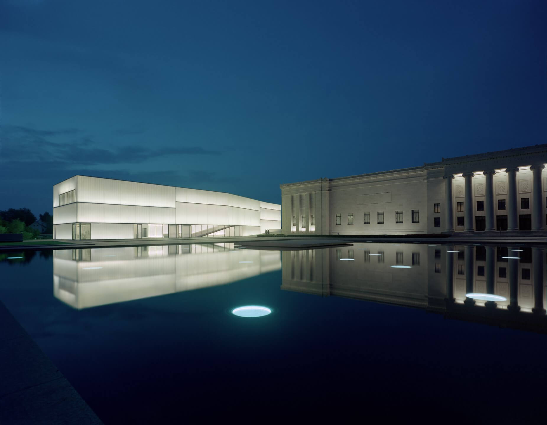 brightly lit white building at night